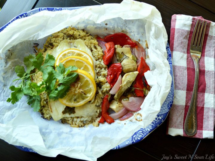 Lemon Roasted Tilapia and Vegetables Plated. Dinner for two has never been so easy and delicious. This Fresh Lemon Roasted Tilapia and Vegetables are full of fresh flavor and spices.