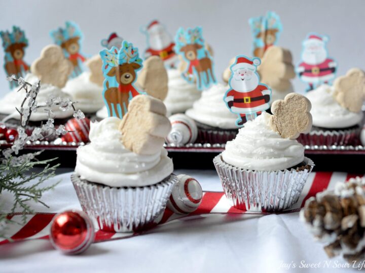 A quick and easy holiday dessert recipe, these Marshmallow Christmas Cupcakes are made with boxed cake mix for a hassle-free cupcake recipe. Top these moist chocolate cupcakes with marshmallow frosting and fun holiday-themed candy.