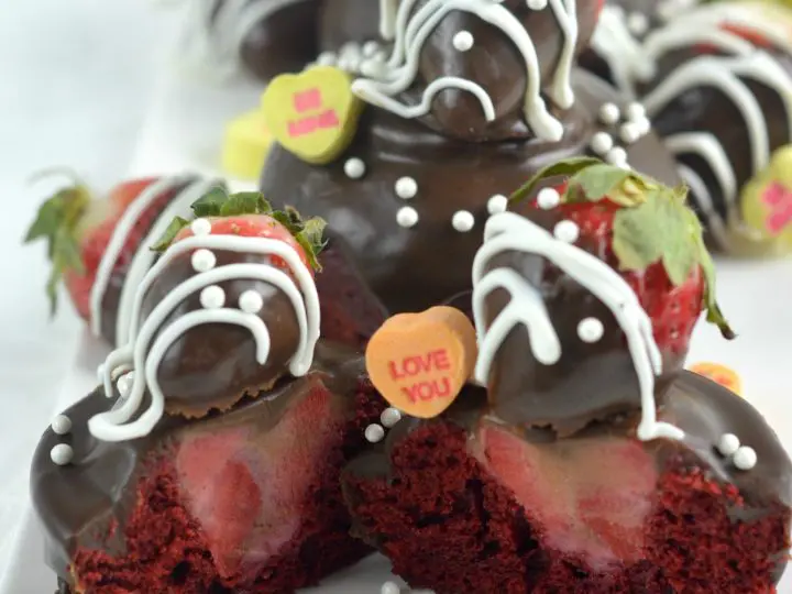Strawberry Valentines Day Cupcakes hero 3.1. Make these deliciously moist Red Velvet Cupcakes stuffed with Strawberries. Topped with Chocolate Ganache and chocolate dipped strawberries.