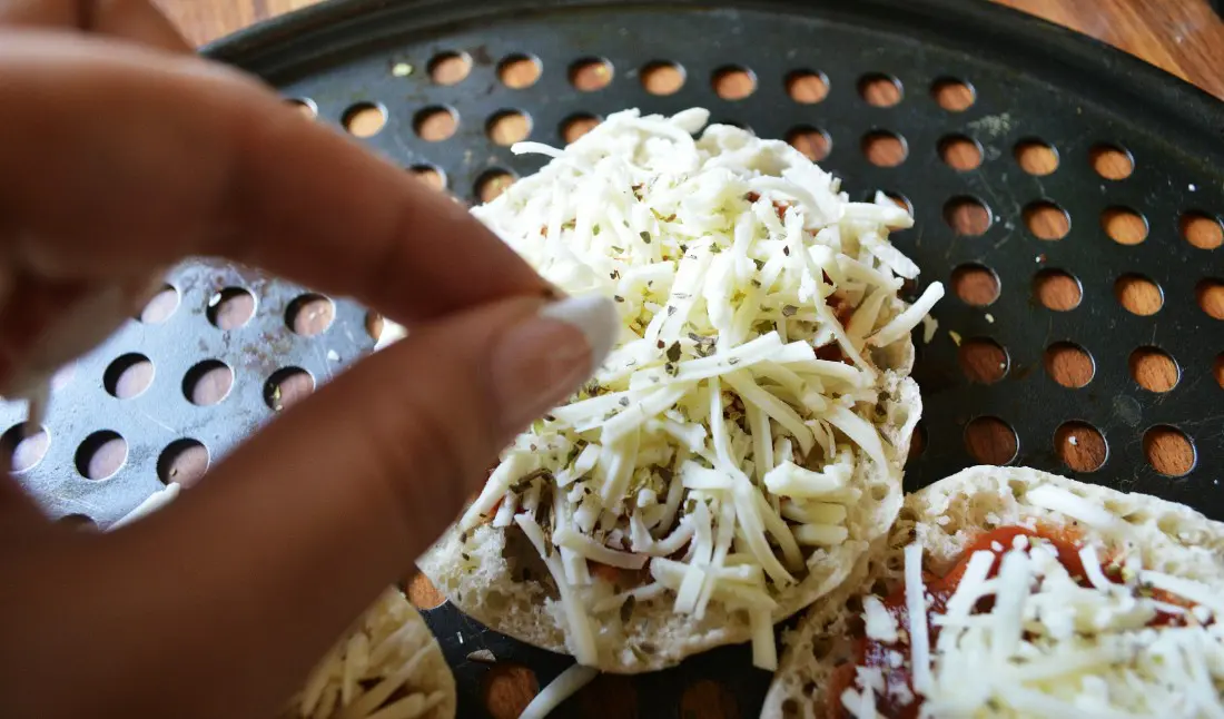 An easy and delicious recipe, this English muffin pizza is the perfect afterschool snack option. Add your favorite toppings and fully customize this mini personal pizza however you want.
