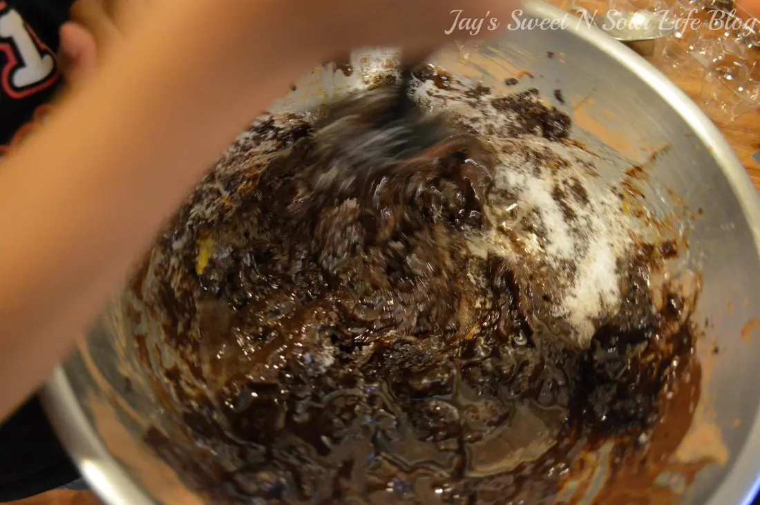 fudgy brownie cheesecake mixing. Decadent made from scratch fudgy brownies smothered with a creamy cheesecake filling. These easy to make fudgy cheesecake brownies are moist and full of decadent chocolate flavor.