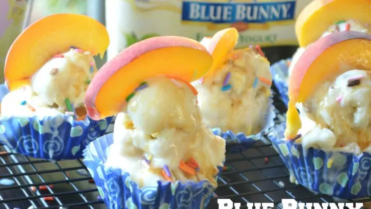 A deliciously refreshing summer treat, these Mini Ice Cream Cakes are perfect for all ages. Made with a chocolate cookie crust, this cupcake-inspired Mini Ice Cream Cake is topped with fresh slices of peaches and sprinkles.