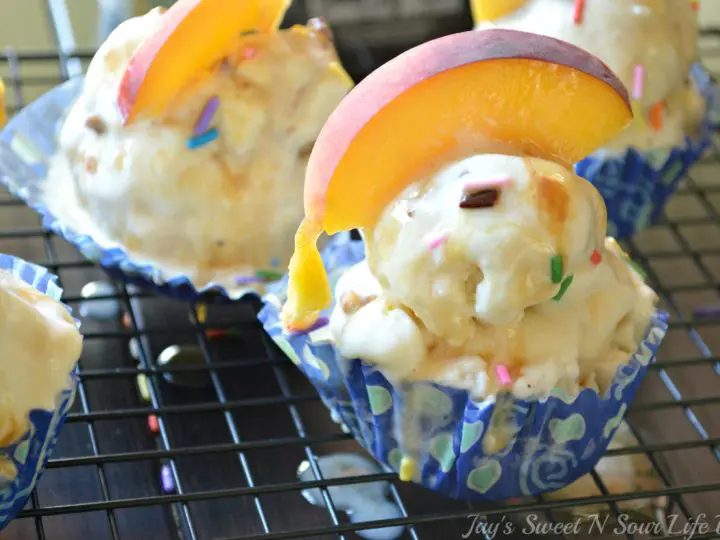 A deliciously refreshing summer treat, these Mini Ice Cream Cakes are perfect for all ages. Made with a chocolate cookie crust, this cupcake-inspired Mini Ice Cream Cake is topped with fresh slices of peaches and sprinkles.