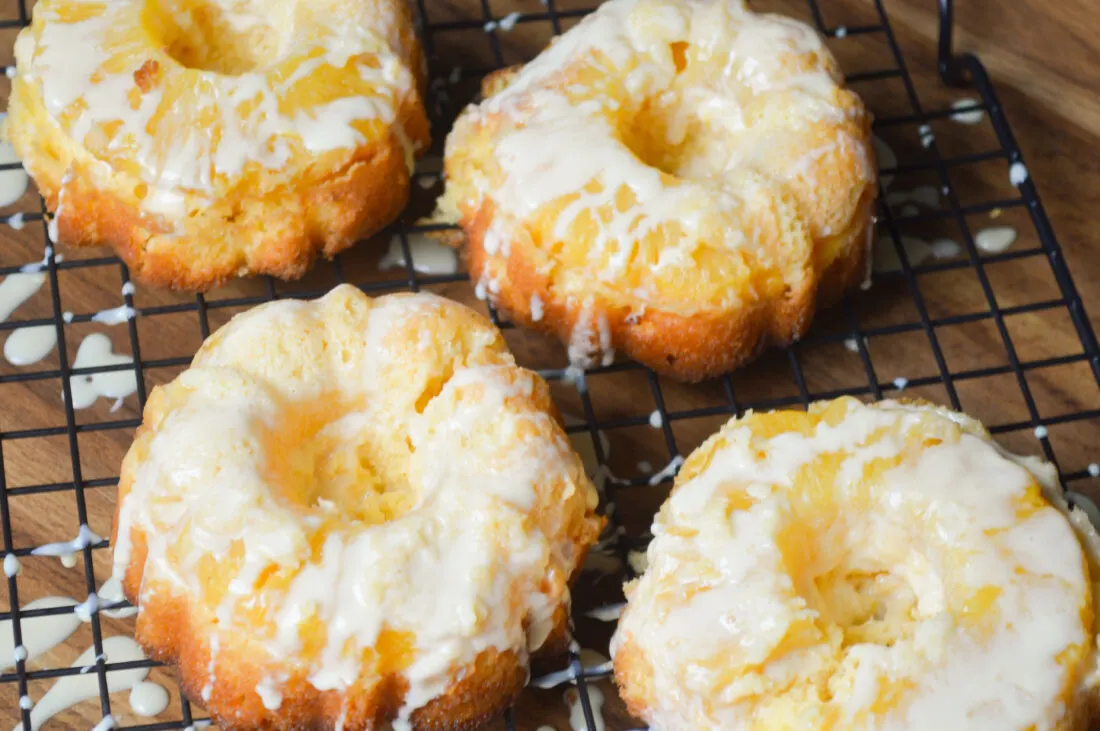 Serve these easy-to-make mini Pineapple Upside Down Cakes at holiday parties, or family get-togethers. This recipe uses a boxed cake mix for a quick and easy dessert recipe. These mini pineapple upside-down cakes are perfect for any time of the year!