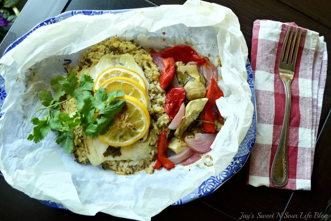 Lemon Roasted Tilapia and Vegetables Plated. Dinner for two has never been so easy and delicious. This Fresh Lemon Roasted Tilapia and Vegetables are full of fresh flavor and spices.