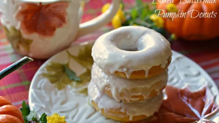 Baked Buttermilk Pumpkin Donuts Closeup Stacked Donuts. Calling all pumpkin lovers! Try my moist Baked Buttermilk Pumpkin Donut Recipe. Frosted with cream cheese and baked to perfection in my No Yeast Recipe.