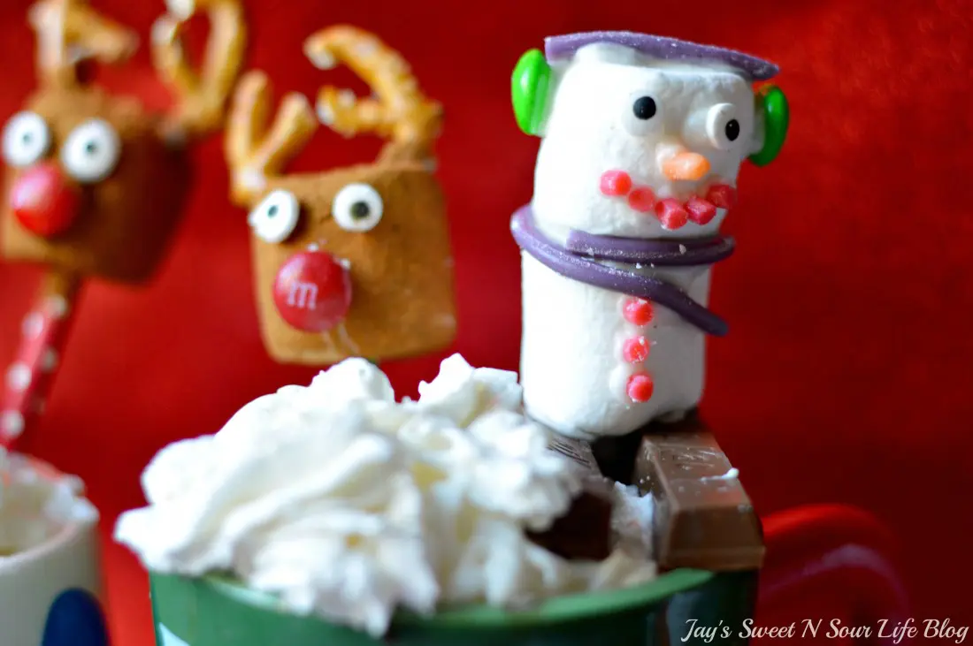 Slow Cooker Eggnog Hot Chocolate Snowman Marshmallow. This decadent Eggnog Hot Chocolate is the perfect holiday drink for Christmas Parties. Made in the slow cooker, this eggnog infused hot chocolate is smooth, creamy, chocolatey, and easy to make.
