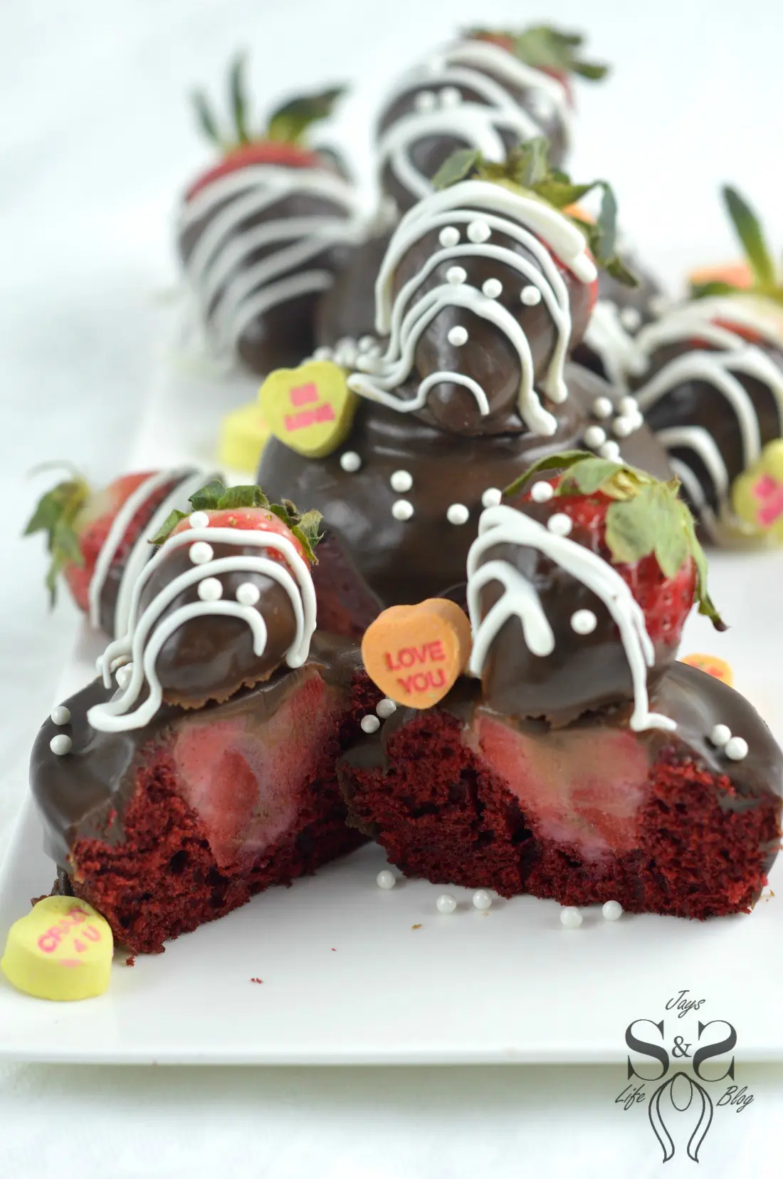 Strawberry Valentines Day Cupcakes hero 3.1. Make these deliciously moist Red Velvet Cupcakes stuffed with Strawberries. Topped with Chocolate Ganache and chocolate dipped strawberries.