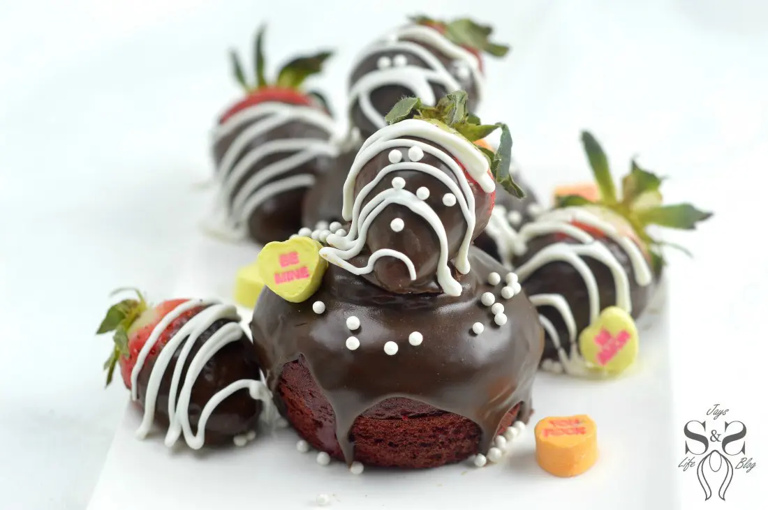 Strawberry Valentines Day Cupcakes hero 4.1. Make these deliciously moist Red Velvet Cupcakes stuffed with Strawberries. Topped with Chocolate Ganache and chocolate dipped strawberries.