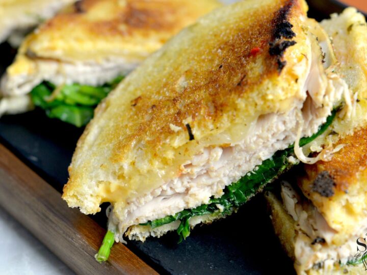 Turkey Pesto Grilled Cheese Sandwich closeup. If you are looking for that restaurant quality bistro sandwich, look no further. Bring the bistro home when you try my Turkey Pesto Grilled Cheese.