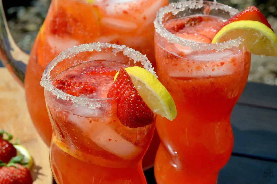 Strawberry Lemonade Closeup. Stop buying premade! Enjoy a freshly squeezed cup of Strawberry Lemonade on a warm sunny day, it's the perfect deliciously refreshing way to cool off. Everything tastes better homemade!