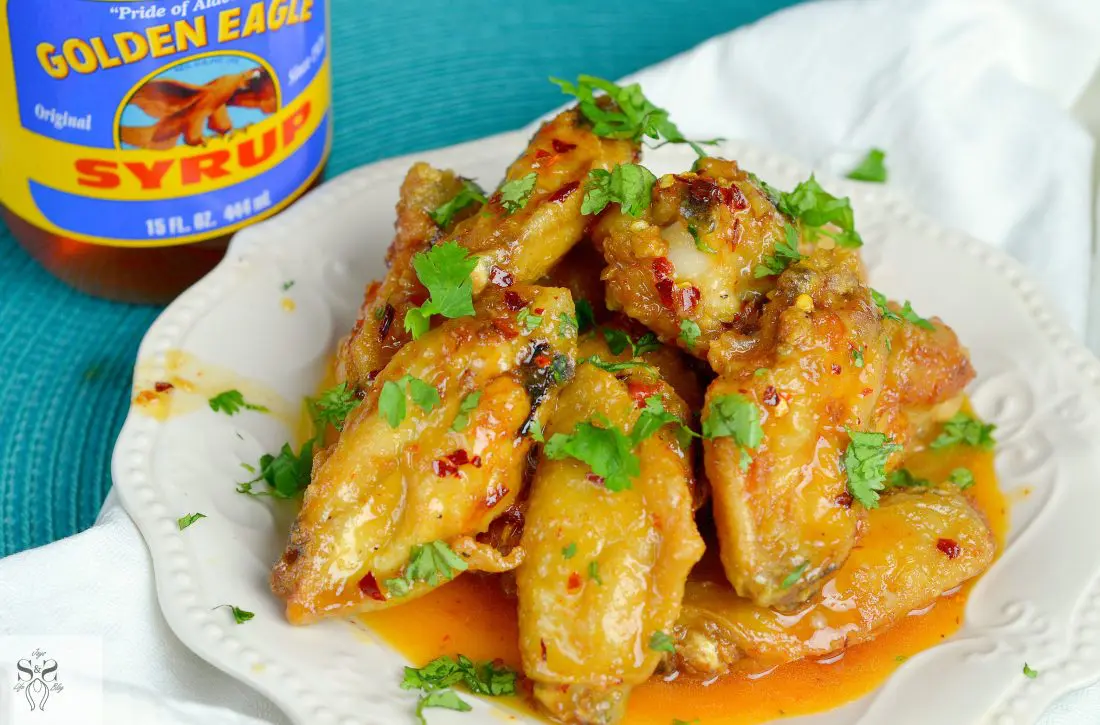 Spicy Buttery Chicken Wings Wideshot plate. Perfect for any night, these Spicy Buttery Chicken Wings are so easy to make and oh so delicious.