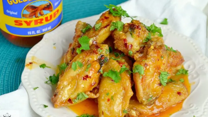 Spicy Buttery Chicken Wings Wideshot plate. Perfect for any night, these Spicy Buttery Chicken Wings are so easy to make and oh so delicious.
