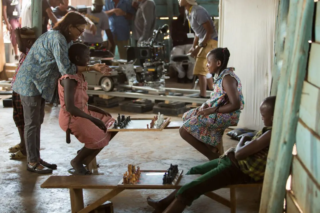 Director Mira Nair on the set of Disney's QUEEN OF KATWE with Madina Nalwanga. The film is based on a true story of a young girl from the streets of rural Uganda whose world changes when she is introduced to the game of chess, the film also star Oscar (TM) winner Lupita Nyong'o.