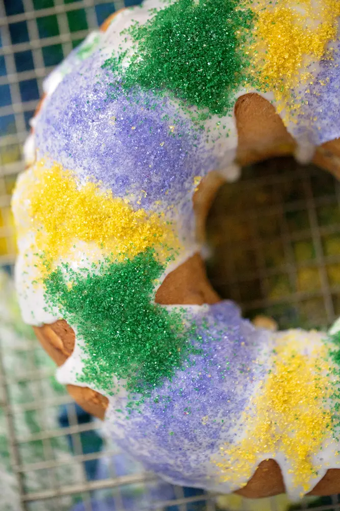Mardi Gras King Cake Decoration. King Cake. Mardi Gras King Cake Filling. Celebrate Mardi Gras with this homemade Mardi Gras King Cake! A fun twist on the traditional King Cake, it's filled with a homemade strawberry filling. Bake and share this easy Strawberry Filled King Cake with your family.