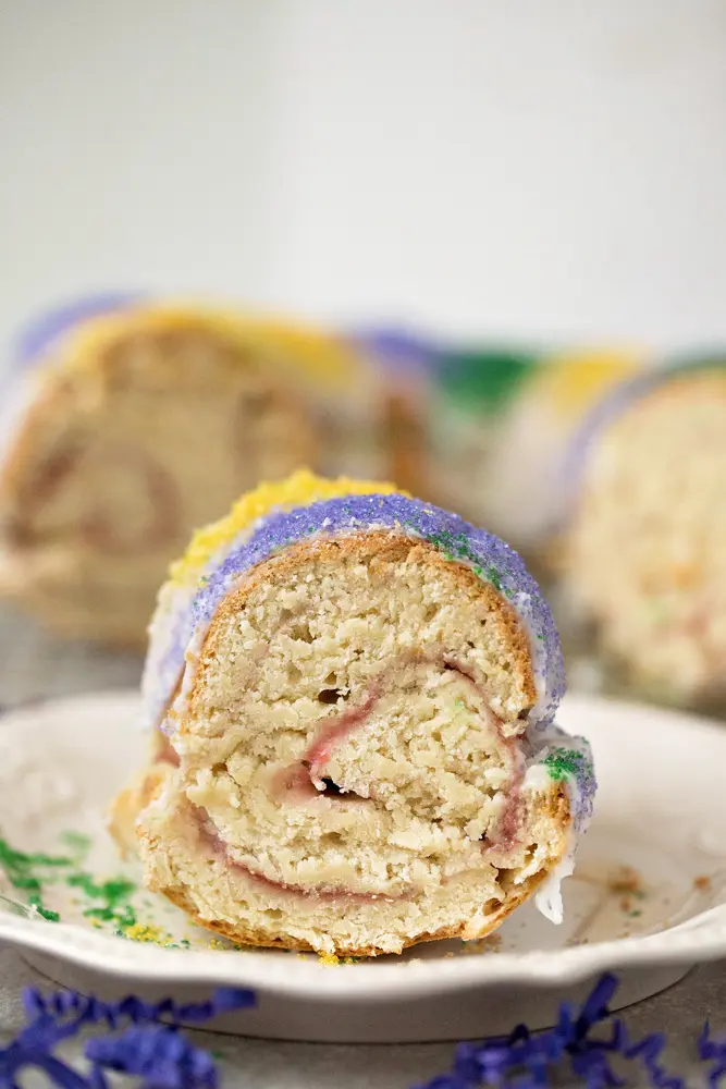 Mardi Gras King Cake Filling. Celebrate Mardi Gras with this homemade Mardi Gras King Cake! A fun twist on the traditional King Cake, it's filled with a homemade strawberry filling. Bake and share this easy Strawberry Filled King Cake with your family.