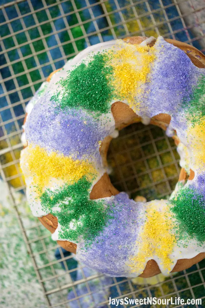 Mardi Gras King Cake Long Shot. Hands down one of my absolute favorite cake recipes. Create a festive cake that the whole family will love. Check out the full recipe to see what secret ingredient I use in my recipe.