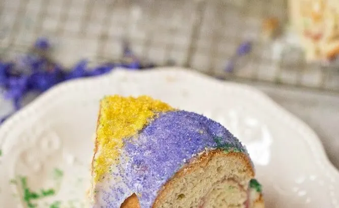 Mardi Gras King Cake Sliced Cake. Hands down one of my absolute favorite cake recipes. Create a festive cake that the whole family will love. Check out the full recipe to see what secret ingredient I use in my recipe.