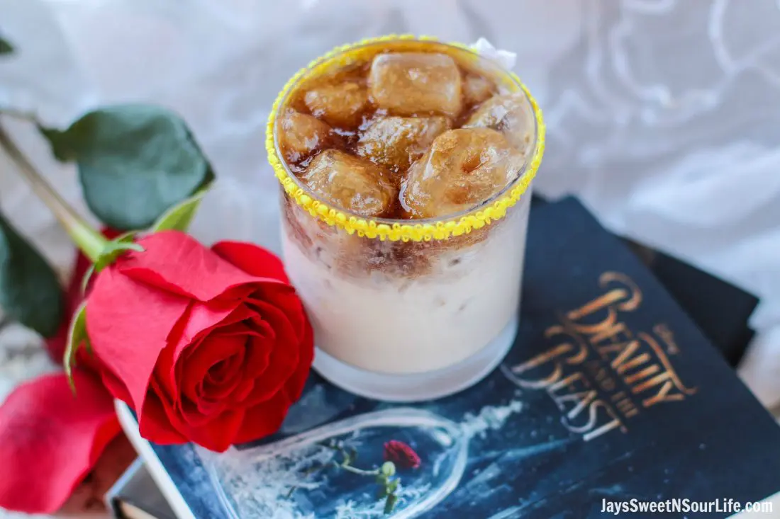 Easy Beauty and the Beast Cocktail. Break the curse with this Disney inspired Beauty and the Beast Cocktail. Made with layers of Kringle Cream Liqueur and Coffee Soda, this simple but elegant cocktail recipe delivers a delicious big flavor.