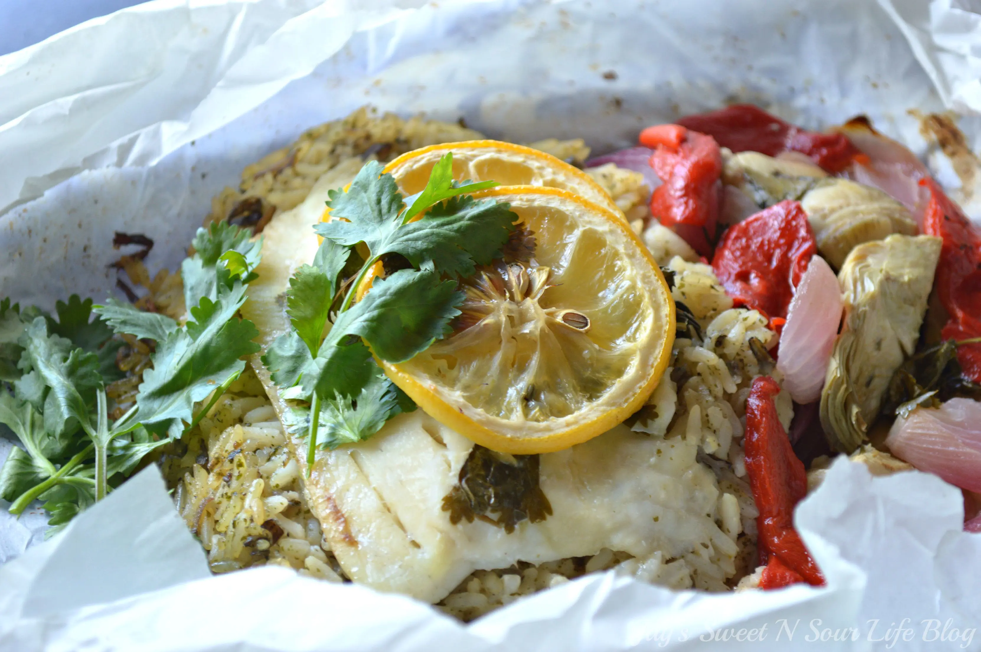 Lemon Roasted Tilapia and Vegetables Closeup. Dinner for two has never been so easy and delicious. This Fresh Lemon Roasted Tilapia and Vegetables are full of fresh flavor and spices.