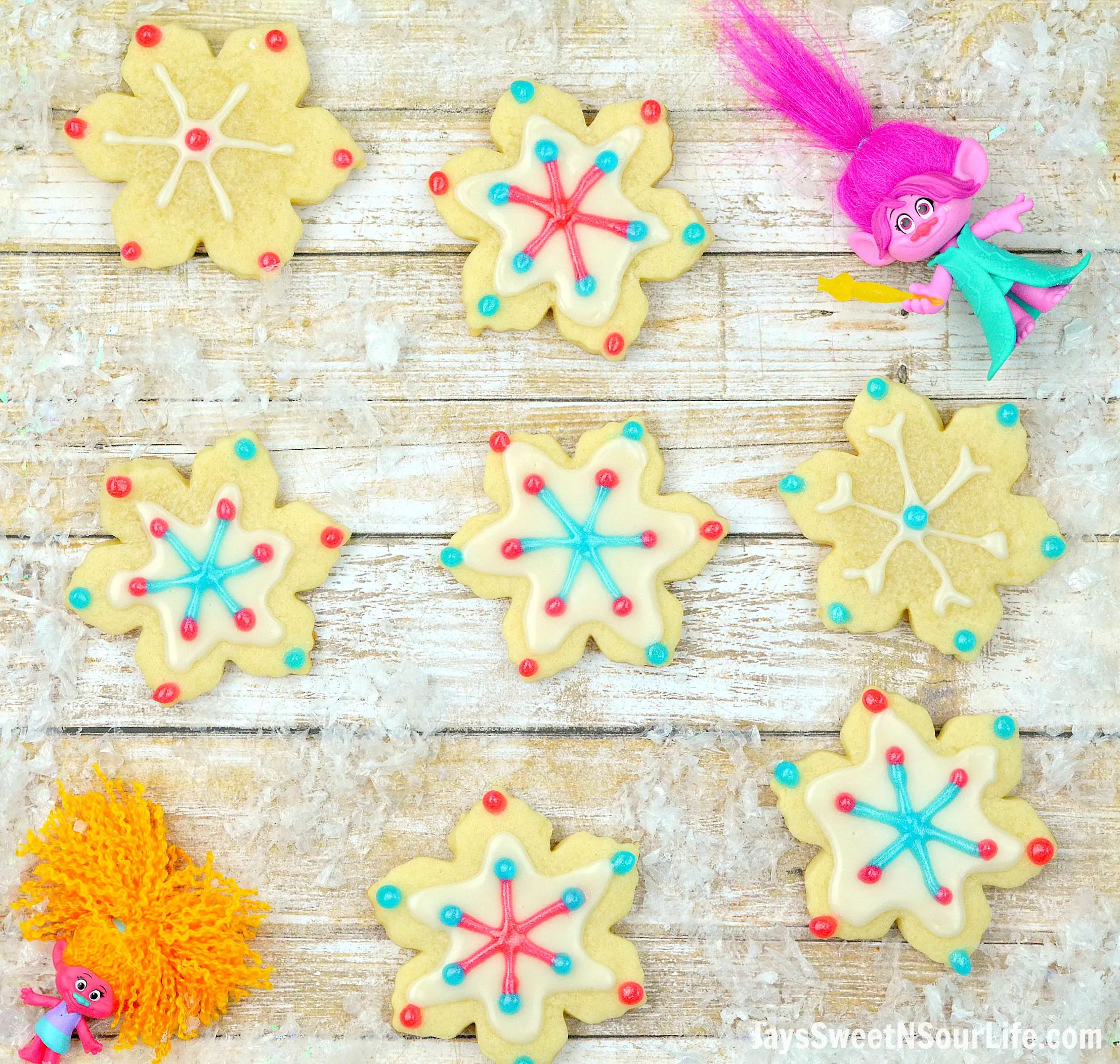 Trolls Holiday Sugar Cookies. Bake, stack, and decorate these Trolls inspired Sugar Cookies. Decked out in fun Trolls Holiday themed colors, this fun Troll's Sugar Cookie Christmas Tree is a fun recipe and Christmas craft all in one!