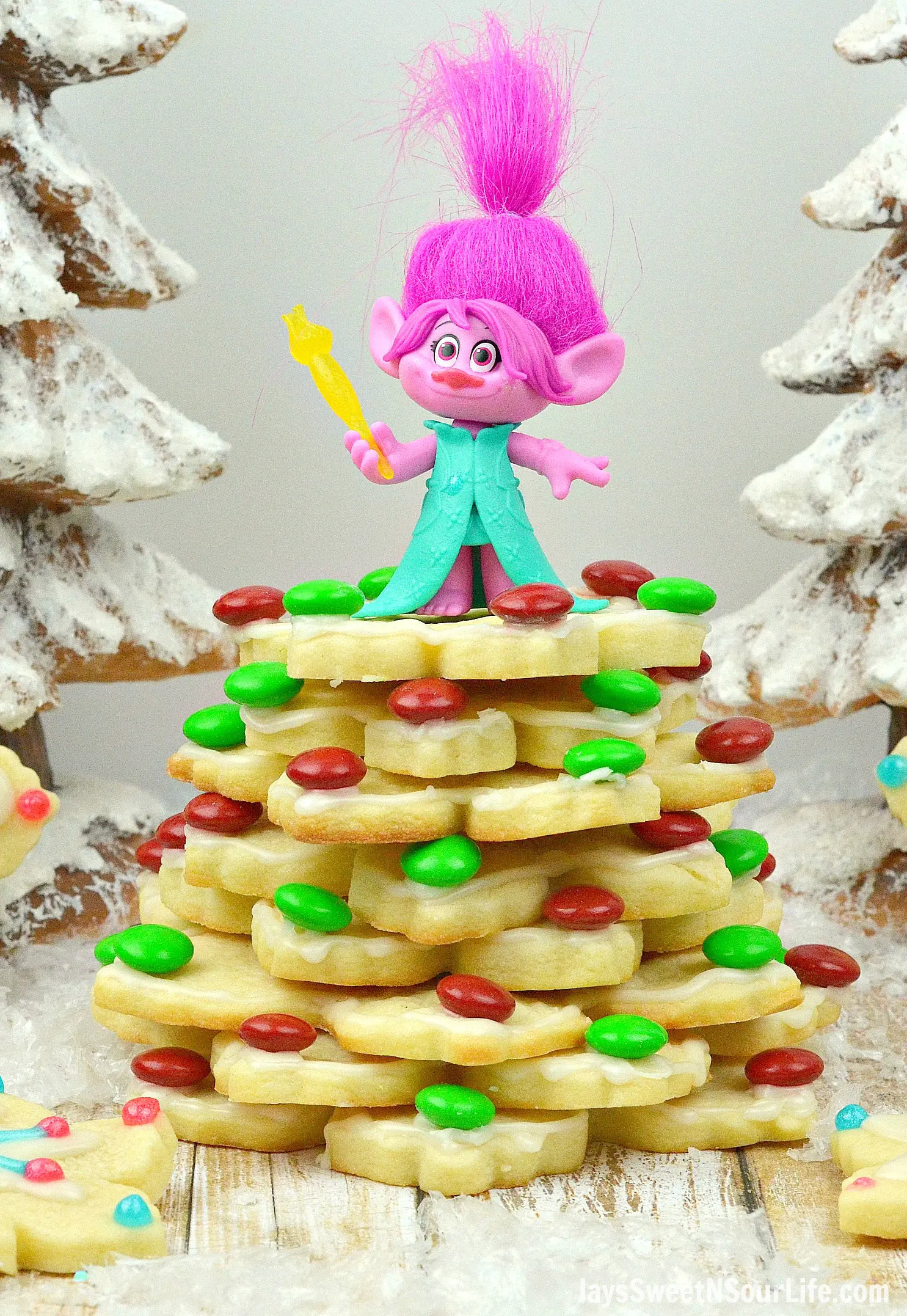 Trolls Holiday Tree Sugar Cookies Poppy. Bake, stack, and decorate these Trolls inspired Sugar Cookies. Decked out in fun Trolls Holiday themed colors, this fun Troll's Sugar Cookie Christmas Tree is a fun recipe and Christmas craft all in one!