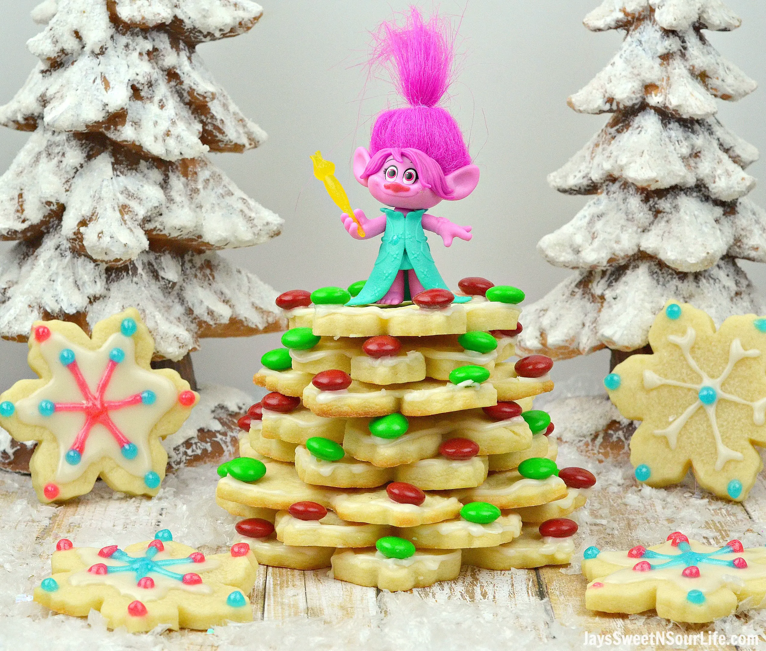 Trolls Holiday Tree Cookies. Bake, stack, and decorate these Trolls inspired Sugar Cookies. Decked out in fun Trolls Holiday themed colors, this fun Troll's Sugar Cookie Christmas Tree is a fun recipe and Christmas craft all in one!