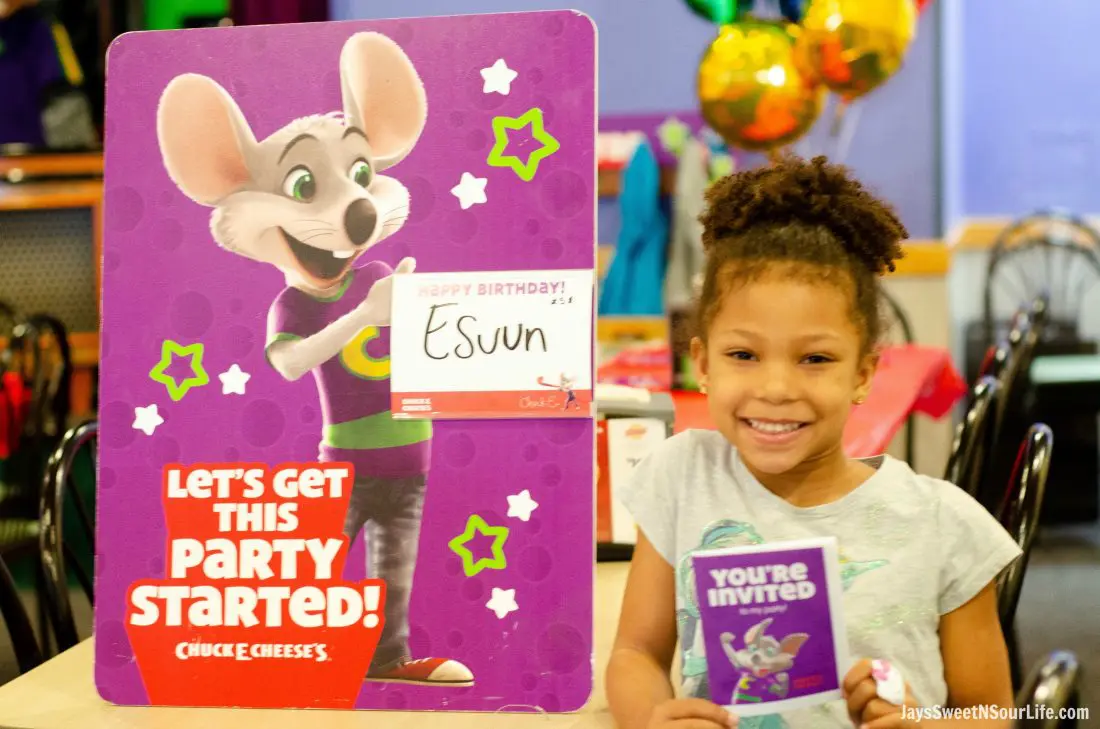 Chuck e cheeses VIP birthday party girl in front of sign with her name on it. Book your party today and have guests enjoy 2 hours of unlimited game play.