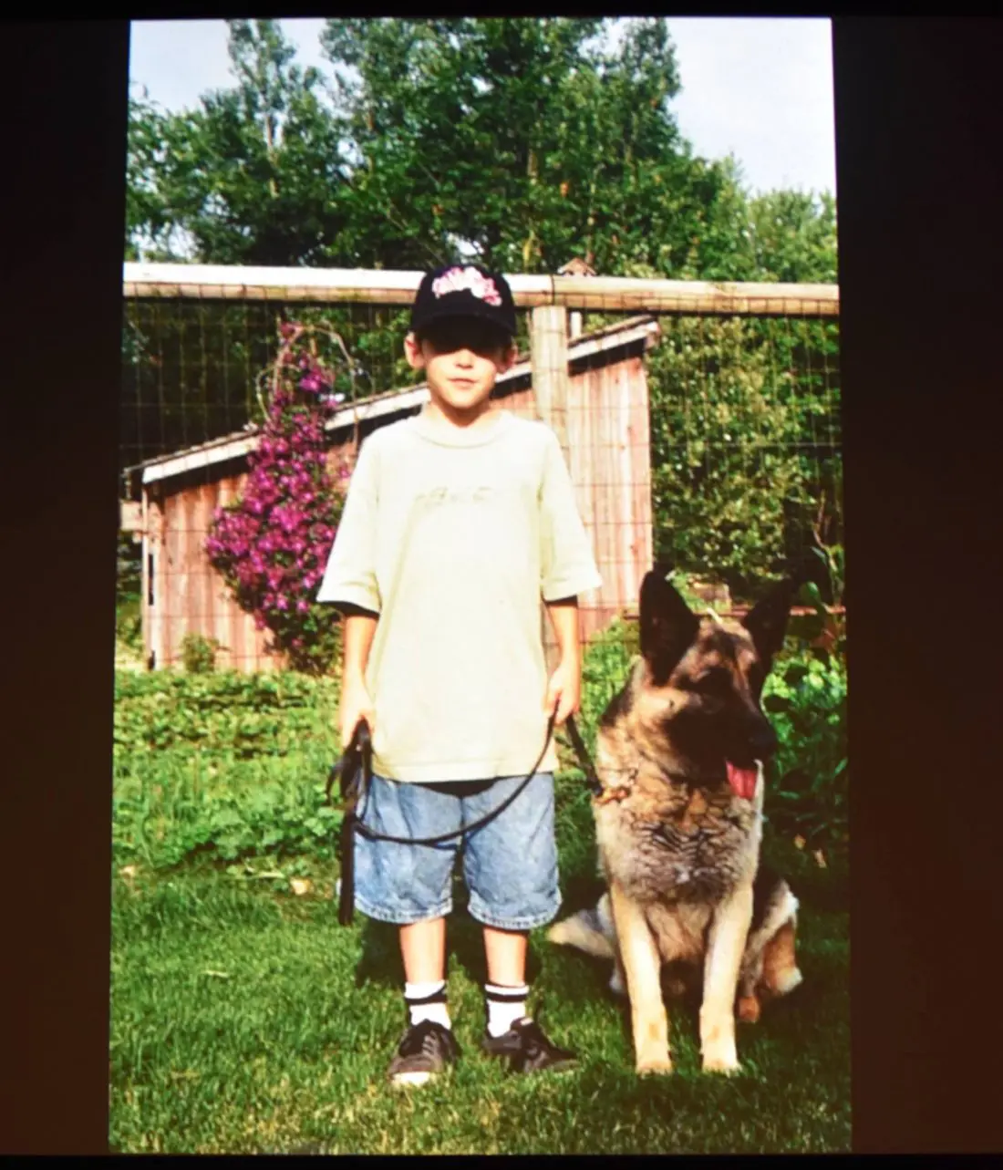 Shane Houghton creator of Big City Greens as a child in photo snapshot with dog. Big City Greens premieres June 18 at 9:30 a.m. on Disney Channel, DisneyNOW, and Disney Channel VOD.