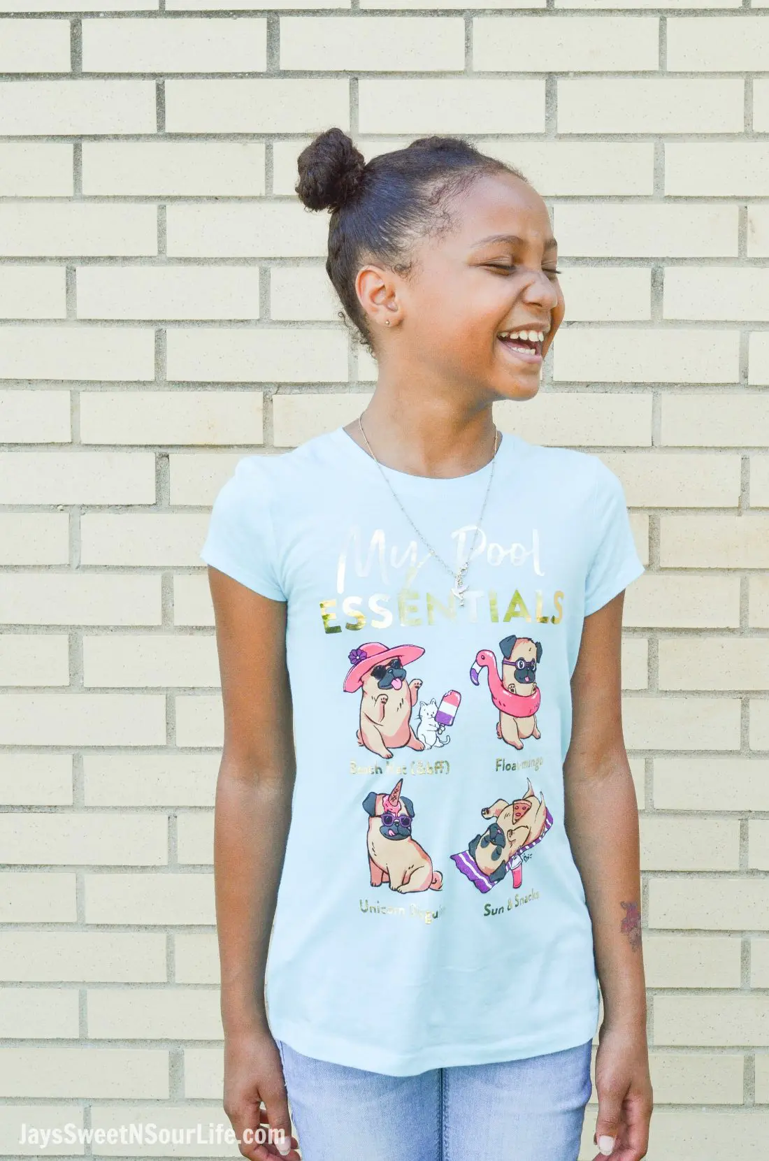 Justice Back To School Shirt Lifestyle Infront of Wall. Back To School Must Have Fashion For Tweens via JaysSweetNSourLife.com
