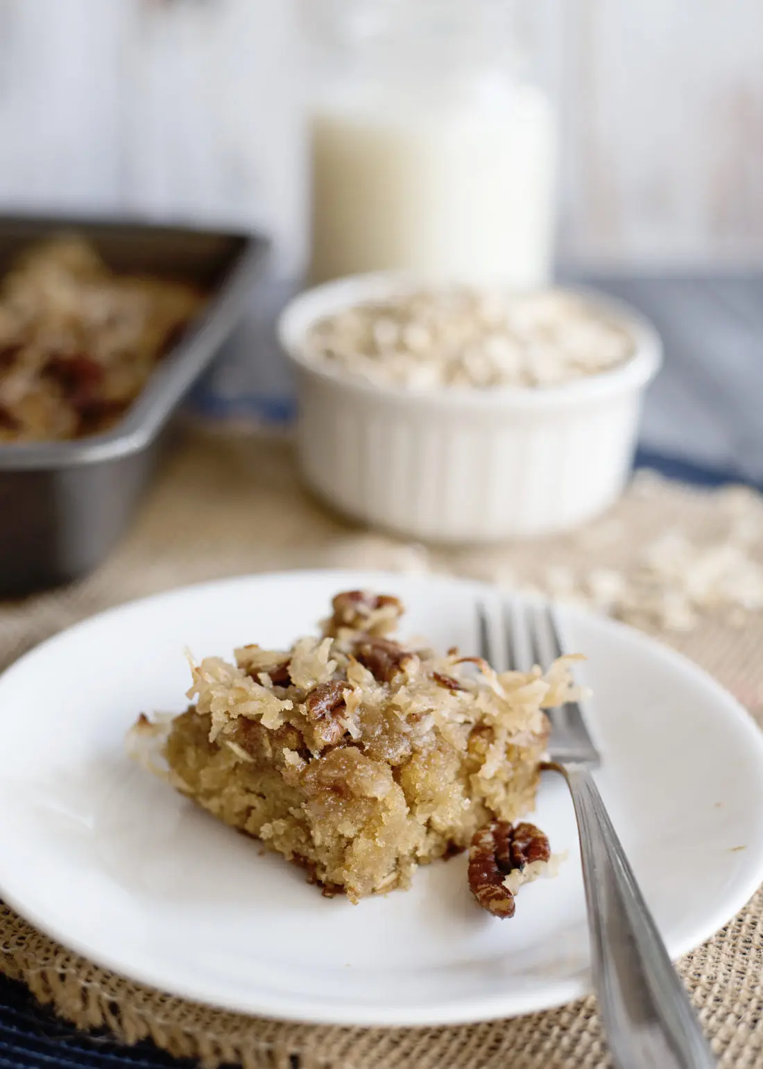 Oatmeal cake with coconut pecan frosting is a classic snack cake that has been around for many years. try this slice of Oatmeal Cake with Pecan Frosting at your next get together.