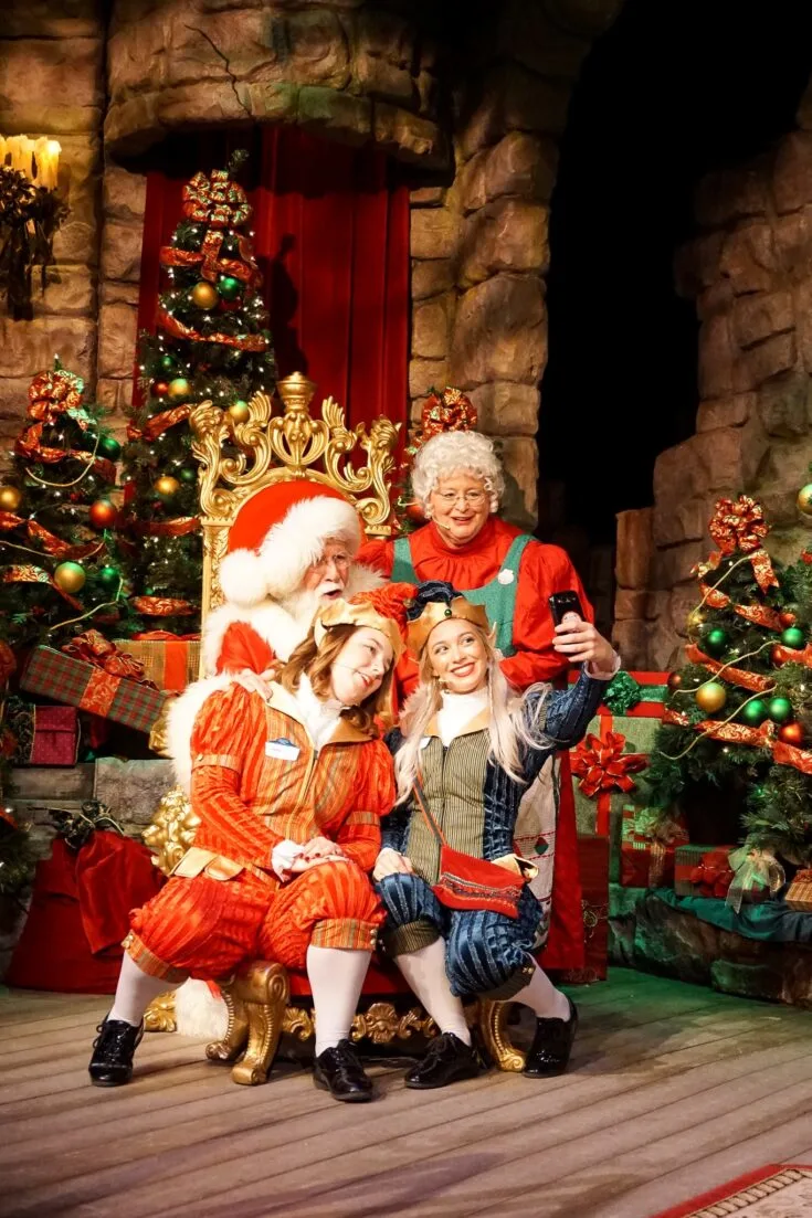 Santas Fireside Feast Elves Santa Selfie. Gather around as Santa recounts a classic Christmas story while elves prepare a scrumptious all-you-care-to-eat meal and Mrs. Claus dazzles the dining room with holiday cheer. Read more about this wonderful feast at Busch Gardens Christmas Town in Williamsburg, Virginia.
