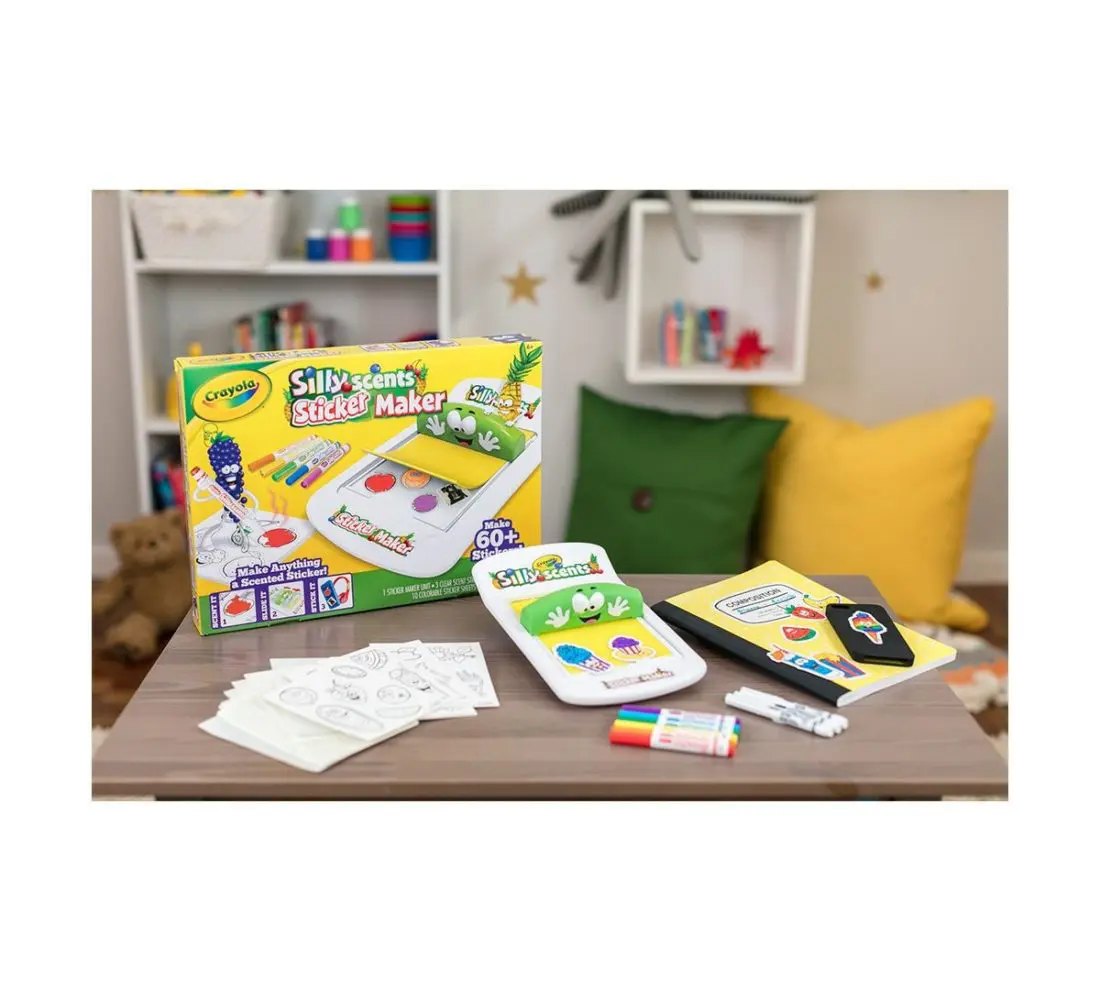 The Crayola Silly Scents Sticker Maker lets you turn almost anything into a custom sticker. To start creating your own DIY stickers just place an adhesive sheet on the sticker bed and place a magazine picture or the included line art on top.