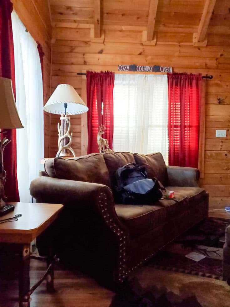 The Mountain Charm Eagles Ridge Resorts Cabin Couch. The Mountain Charm 3 Bedroom Cabin at Eagles Ridge Resort offers ample space and luxury. The perfect place to stay during a family vacation to Pigeon Forge, TN.