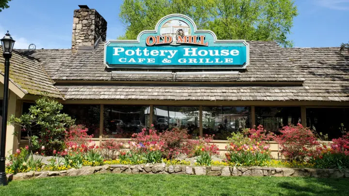 The Old Mill Pottery House Cafe & Grille Front Sign. The Pottery House Cafe serves freshly made sandwiches, salads, and hearty entrees on dishes created by our potters right next door. Read my full review which includes photos of this beautiful and delicious location in Pigeon Forge, TN.