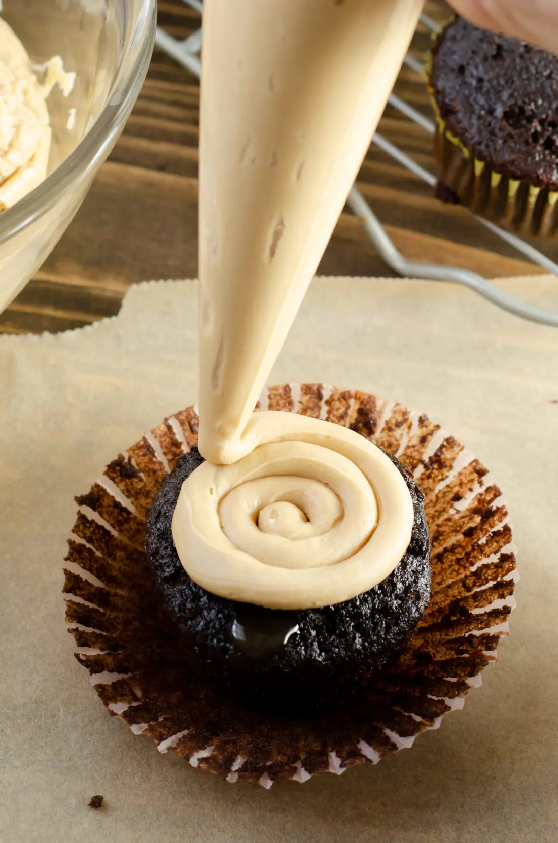 Super Moist Chocolate Cupcakes From Scratch Piped Salted Caramel. Celebrate any occasion with these decadent Super Moist Chocolate Cupcakes From Scratch with Salted Caramel Frosting and Caramel Filled Center. This homemade recipe is so easy to create, the kids can join in.