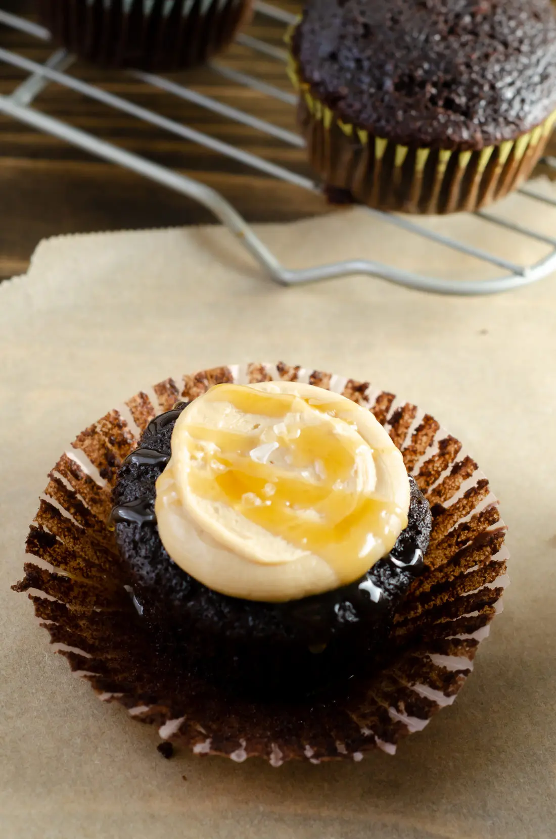 Super Moist Chocolate Cupcakes From Scratch Salted Caramel Frosting Drizilled with caramel and salt. Celebrate any occasion with these decadent Super Moist Chocolate Cupcakes From Scratch with Salted Caramel Frosting and Caramel Filled Center. This homemade recipe is so easy to create, the kids can join in.