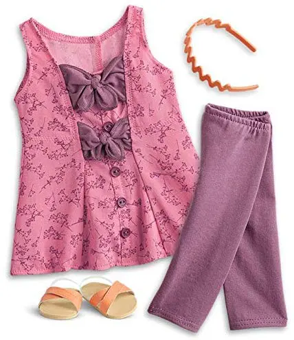 Blaire is always ready for a trip to the local farmers&rsquo; market or craft store to find inspiration for her projects. Outfit includes: A wildflower-print tunic with plum-colored ties and buttons, Plum-colored leggings to match, A scalloped headband for a pop of color in her red curls, Orange crisscross slide sandals