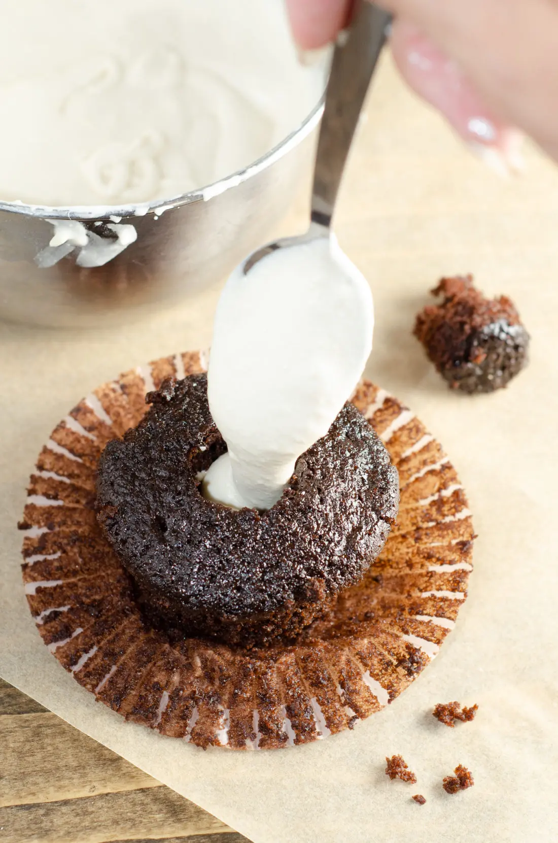 Chocolate Cupcake with Marshmallow Creme Filling. Sink your teeth into a childhood favorite cupcake that is as easy to bake as it is to eat. My Chocolate cupcakes with Chocolate Buttercream frosting and marshmallow creme filling will make the kid in you cheer.
