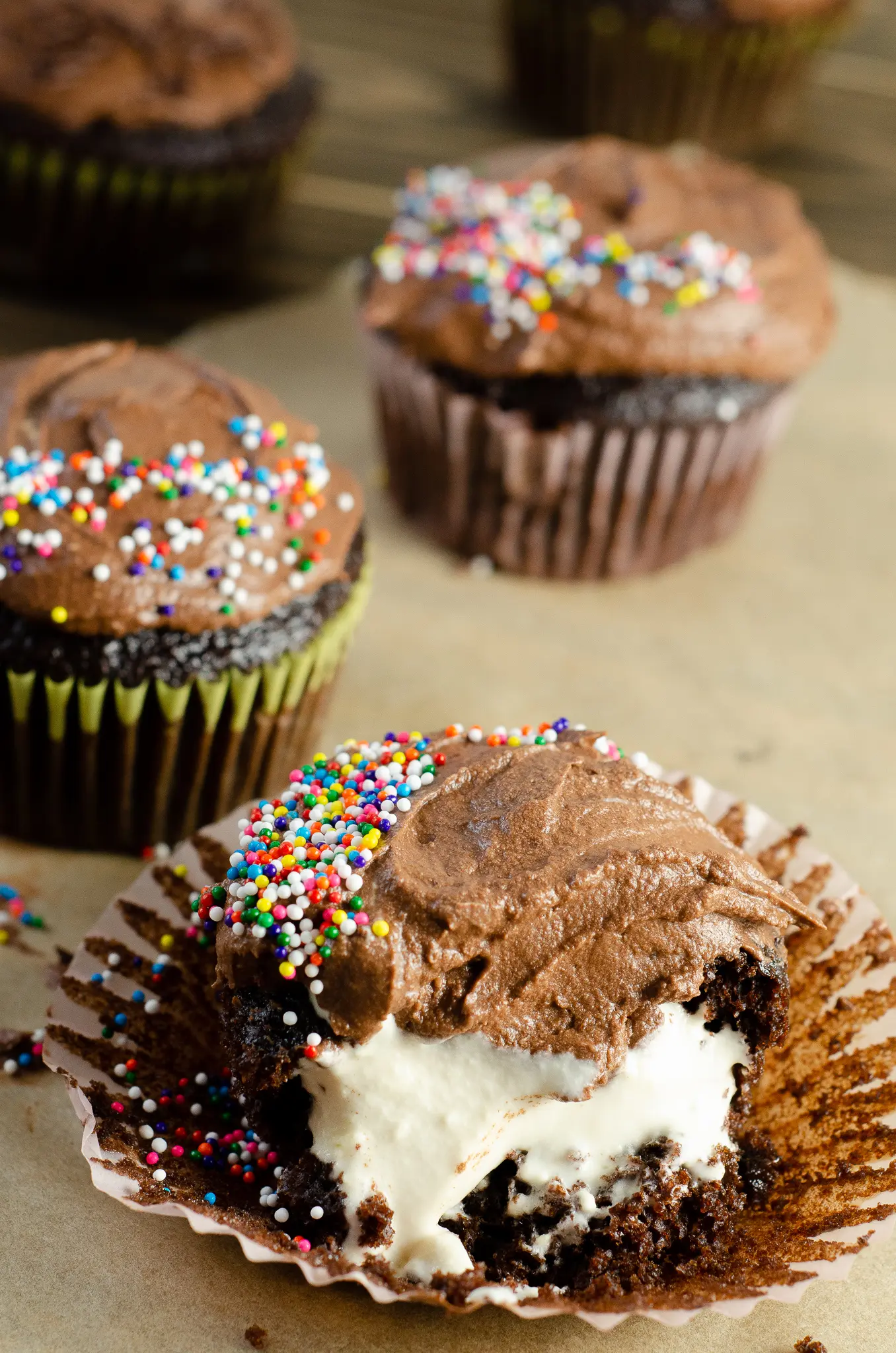 Chocolate Cupcakes with Chocolate Buttercream Frosting - Marshmallow Creme Filling with Sprinkles. Sink your teeth into a childhood favorite cupcake that is as easy to bake as it is to eat. My Chocolate cupcakes with Chocolate Buttercream frosting and marshmallow creme filling will make the kid in you cheer.