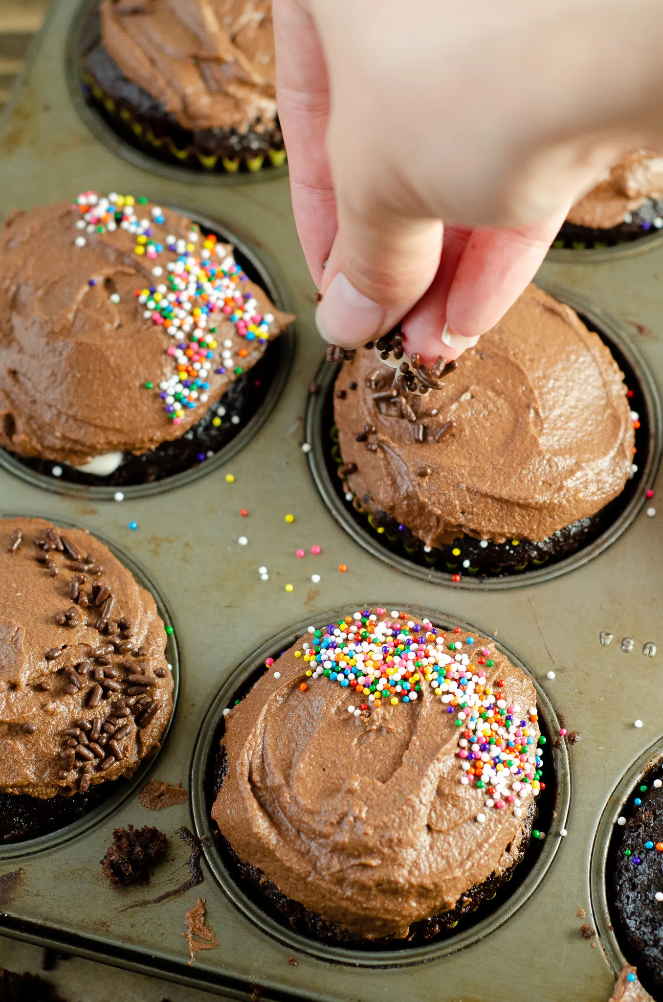 Chocolate Cupcakes with Chocolate Buttercream Frosting - Marshmallow Creme Filling Sprinkles Added. Sink your teeth into a childhood favorite cupcake that is as easy to bake as it is to eat. My Chocolate cupcakes with Chocolate Buttercream frosting and marshmallow creme filling will make the kid in you cheer.