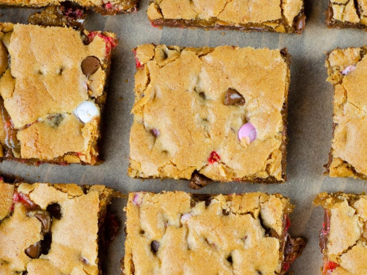 Browned Butter M&M Blondies Bars. These Valentine's day themed Browned Butter M&M Blondies are the perfect way to say I heart you to someone special. I love to bake them for my little ones year-round. They are so chewy and chocolatey they make it easy for me to look like a master dessert chef.