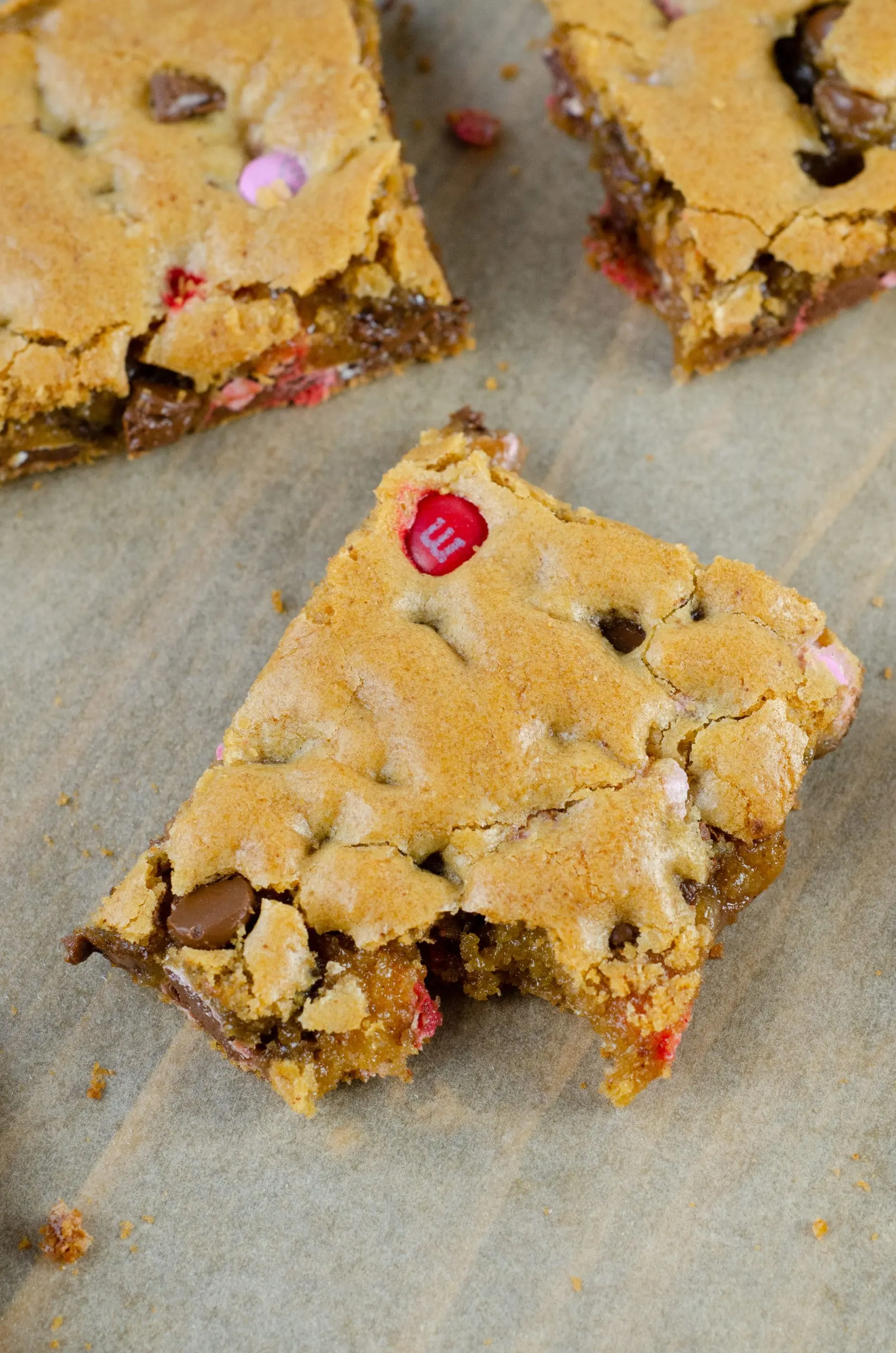 Browned Butter M&M Blondies Bite Bars. These Valentine's day themed Browned Butter M&M Blondies are the perfect way to say I heart you to someone special. I love to bake them for my little ones year-round. They are so chewy and chocolatey they make it easy for me to look like a master dessert chef.