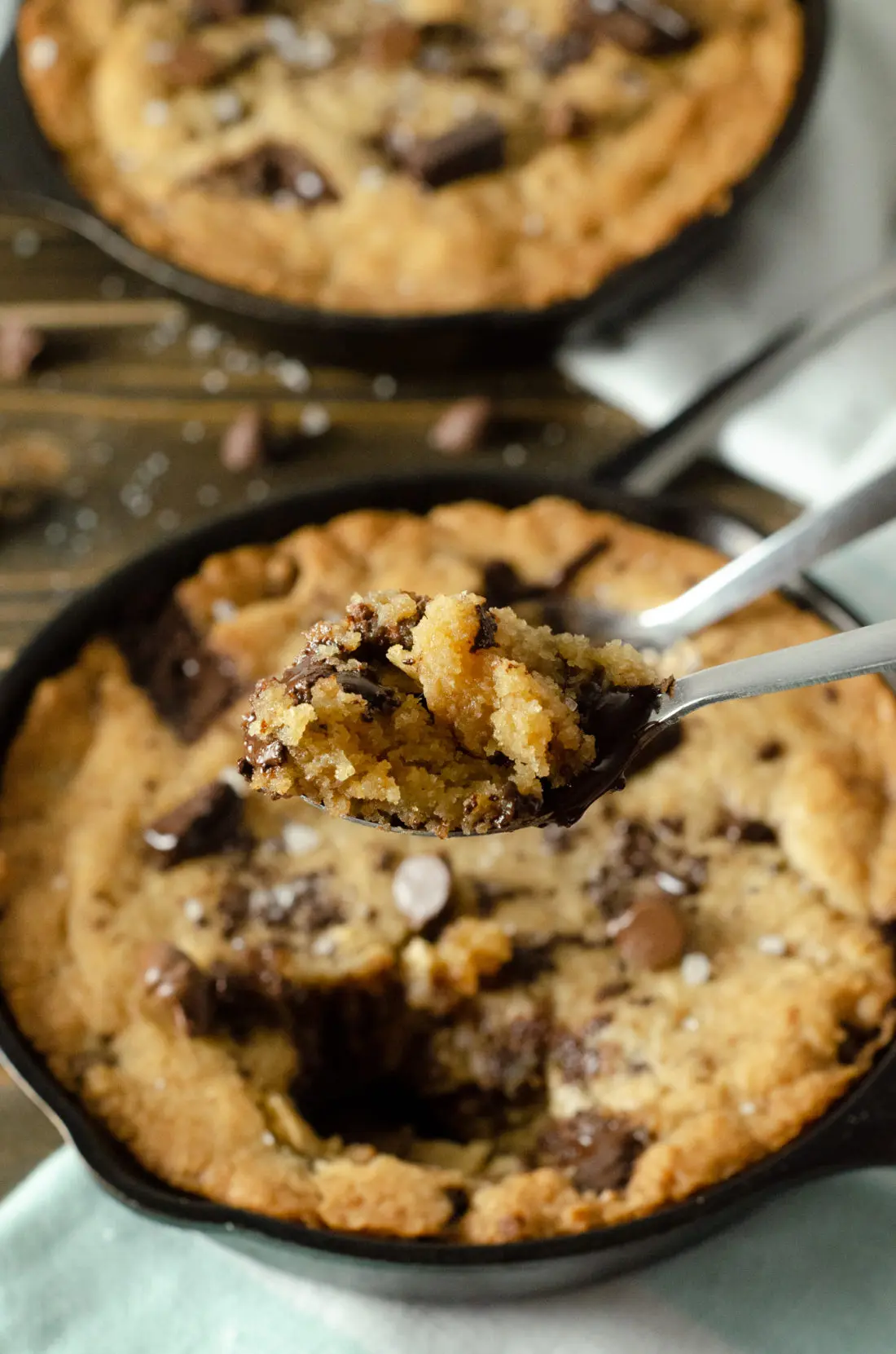 Chocolate Chip Skillet Cookie Scoop. This brown butter Chocolate Chip Skillet Cookie is packed with chunks of chocolate and topped with sea salt, it's the perfect dessert for two. The insanely soft center and crispy buttery edges will have you falling in love with this easy pizookie recipe.