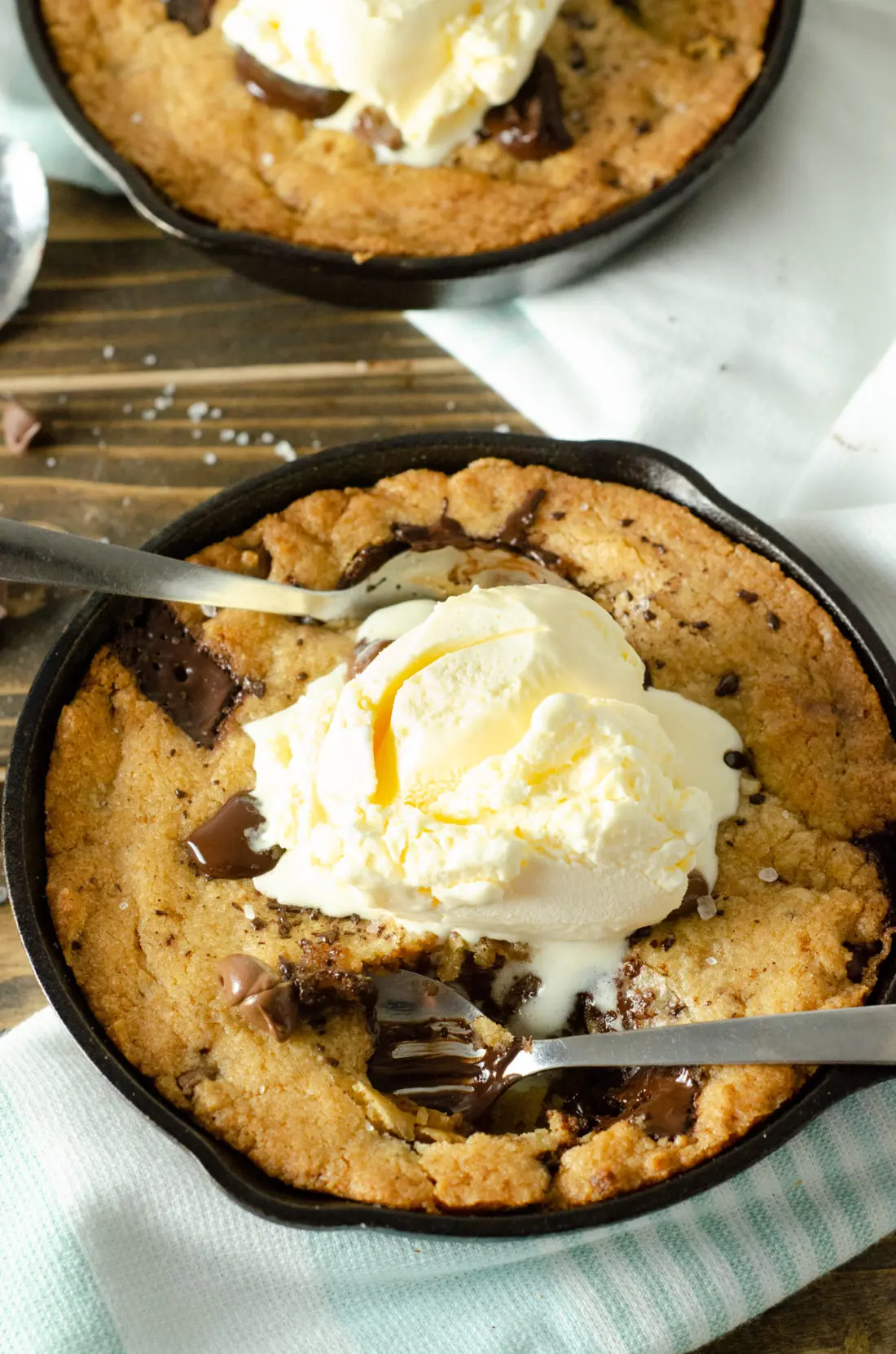 Chocolate Chip Skillet Cookie. This brown butter Chocolate Chip Skillet Cookie is packed with chunks of chocolate and topped with sea salt, it's the perfect dessert for two. The insanely soft center and crispy buttery edges will have you falling in love with this easy pizookie recipe.