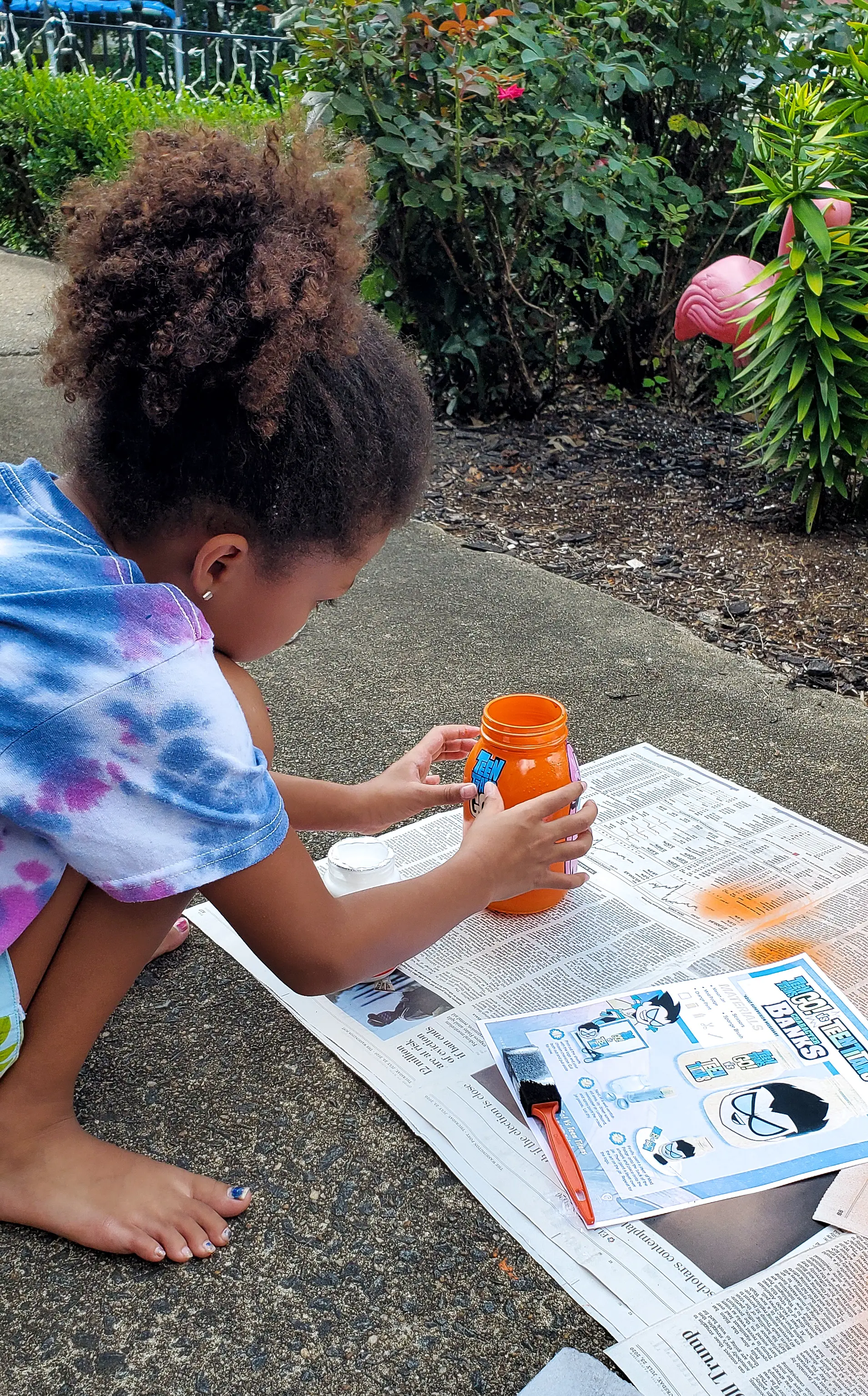 Teen Titans Go!&nbsp;Character Banks Applying Logo. It&rsquo;s week 5 at Camp Warner Bros.! It's time to get crafty with this week's activity Teen Titans Go! Vs. Teen Titans Character Banks. Grab your printables on my blog, along with some more supplies to create your very own Teen Titans Go! vs Teen Titans Character Banks.
