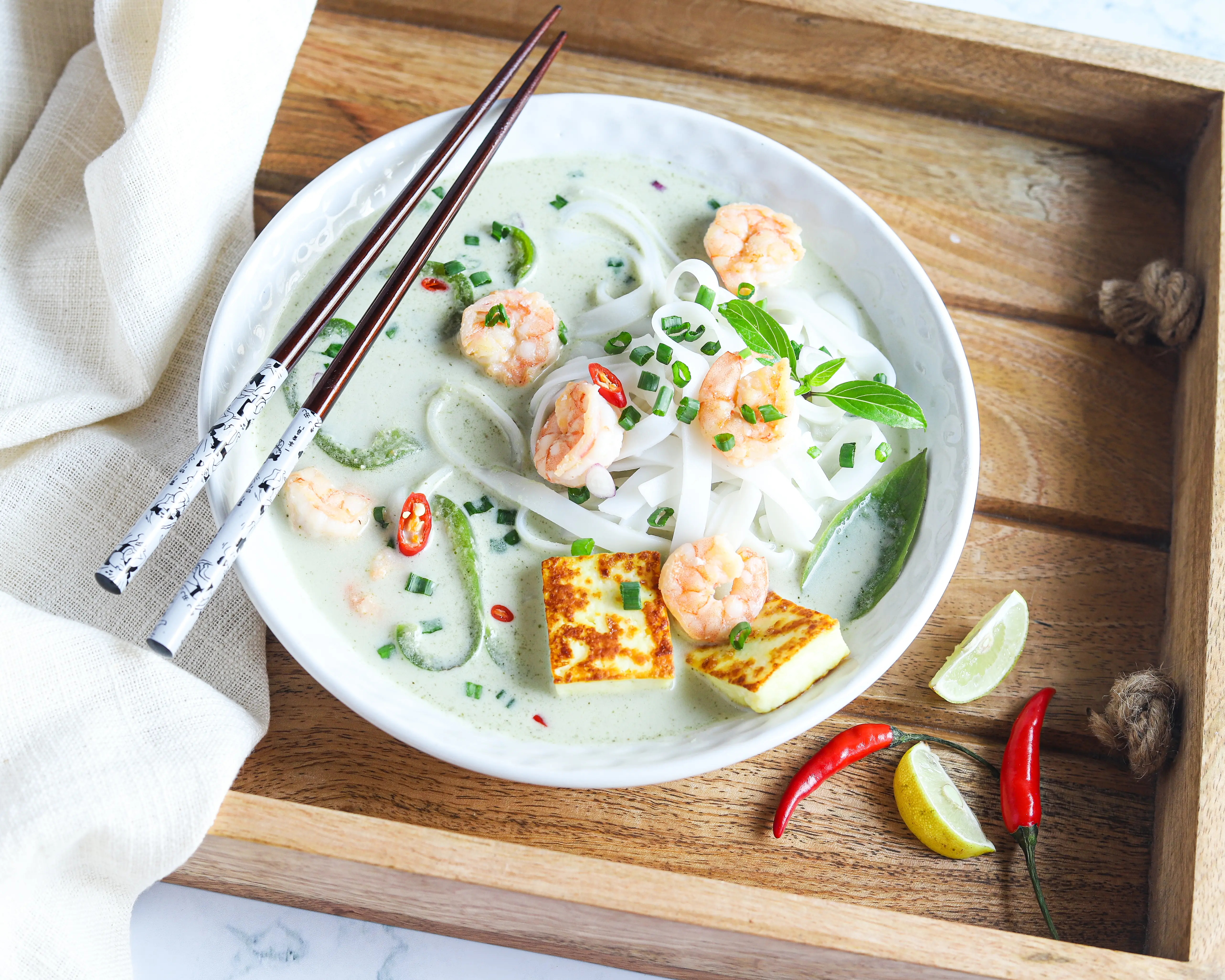 Thai Green Curry Noodles in Tray. These Thai Green Curry Noodles boast a flavorful broth made with coconut milk and fresh ingredients. Fill your bowl with fresh veggies, shrimp, tofu, and rice noodles for a flavorful easy weeknight dinner recipe.