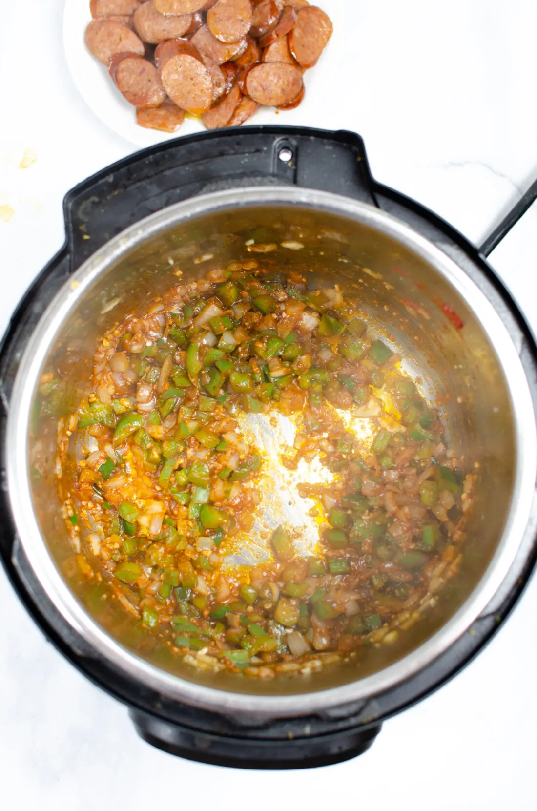 Instant Pot Andouille Sausage Jambalaya Step 3. An authentic Instant Pot Andouille Sausage Jambalaya recipe that can be made in 30 minutes! This flavorful easy one-pan jambalaya recipe is made with andouille sausage, bell peppers, onion, celery, and spices. It's an instant family favorite recipe that is perfect for busy nights.