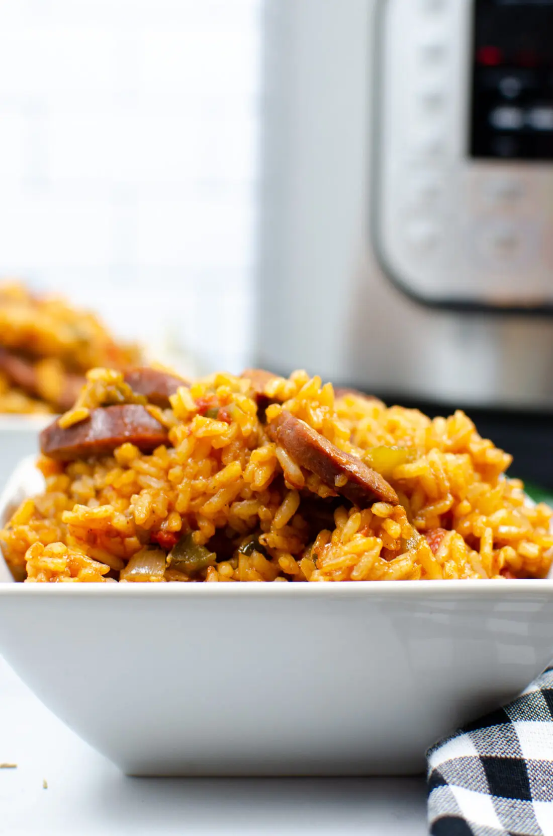 Instant Pot Andouille Sausage Jambalaya in Bowl. An authentic Instant Pot Andouille Sausage Jambalaya recipe that can be made in 30 minutes! This flavorful easy one-pan jambalaya recipe is made with andouille sausage, bell peppers, onion, celery, and spices. It's an instant family favorite recipe that is perfect for busy nights.