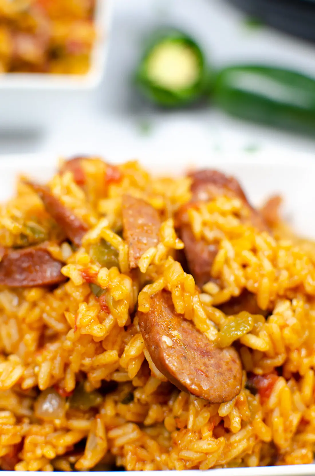 Closeup of Instant Pot Andouille Sausage Jambalaya. An authentic Instant Pot Andouille Sausage Jambalaya recipe that can be made in 30 minutes! This flavorful easy one-pan jambalaya recipe is made with andouille sausage, bell peppers, onion, celery, and spices. It's an instant family favorite recipe that is perfect for busy nights.